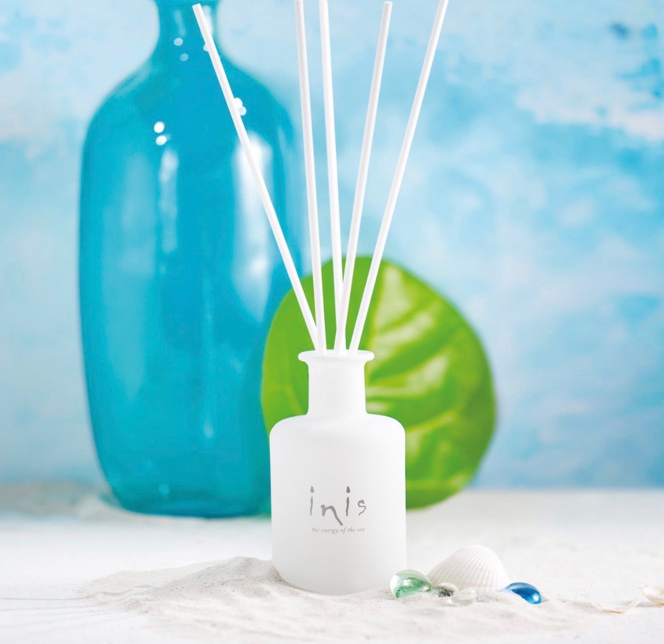 Reed diffuser and coastal glass décor