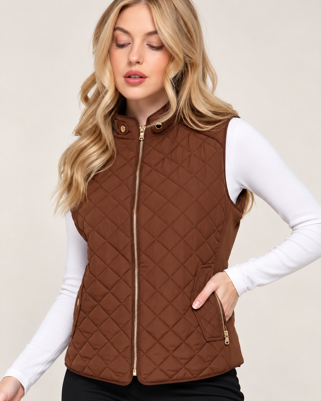 Brown quilted vest layered over a long-sleeve top